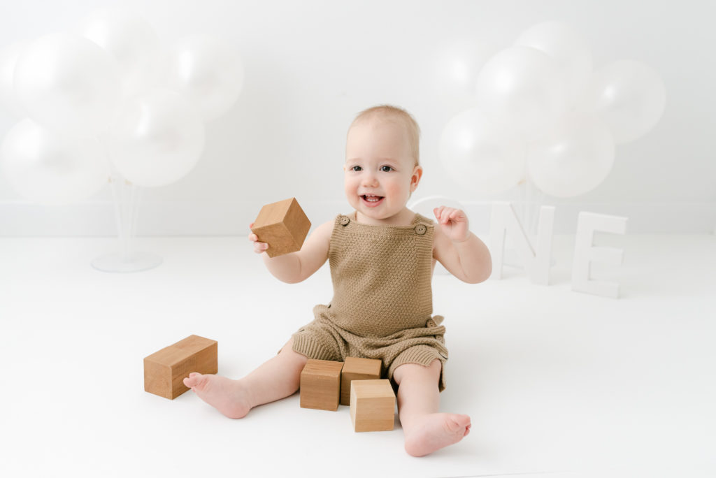 Baby playing with blocks turning one